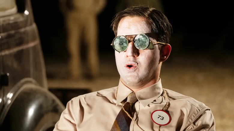 Teller with glasses on watching the Trinity Test in Oppenheimer