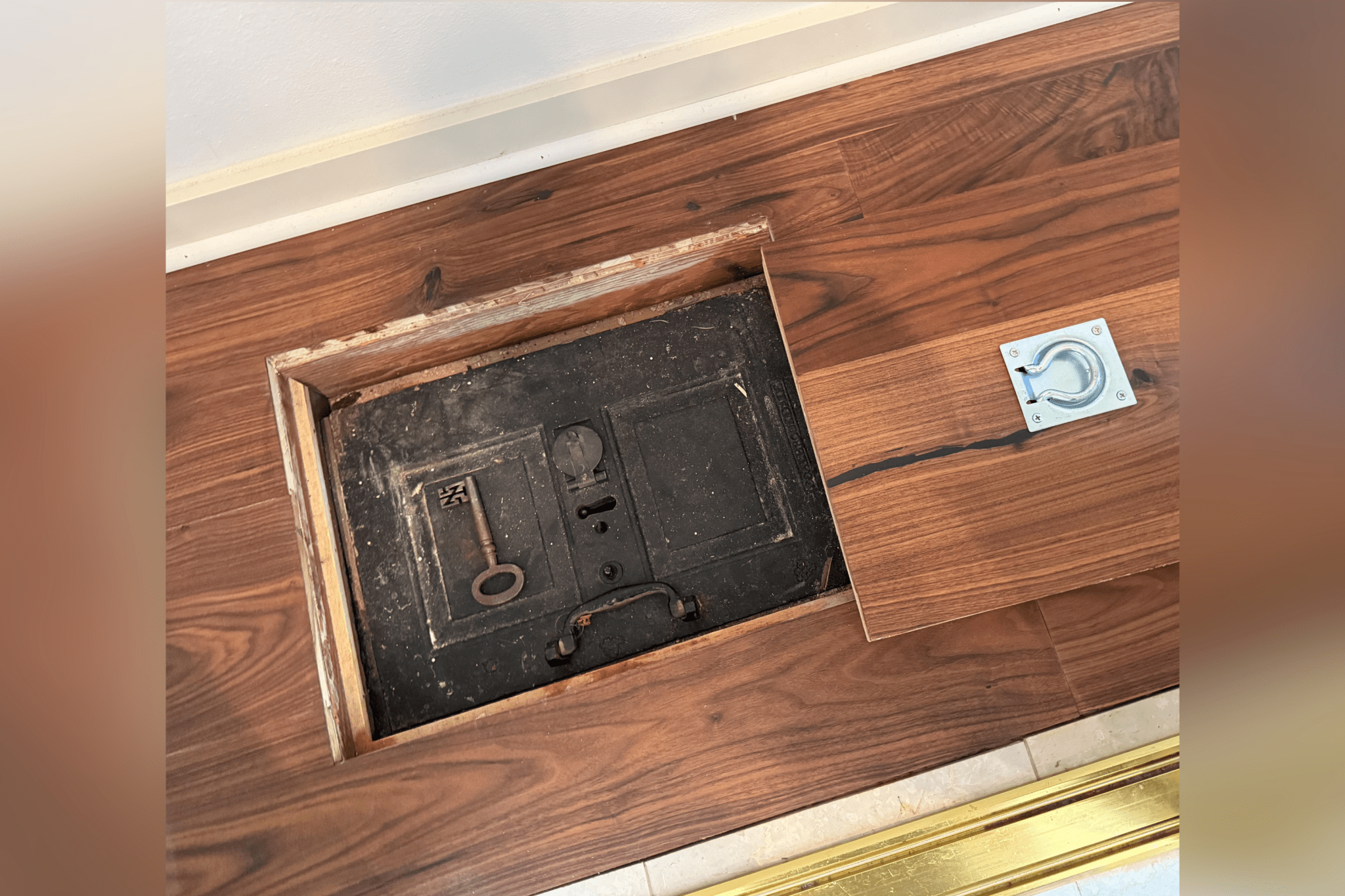 House visitor finds iron chest hidden under floorboards—then opens it