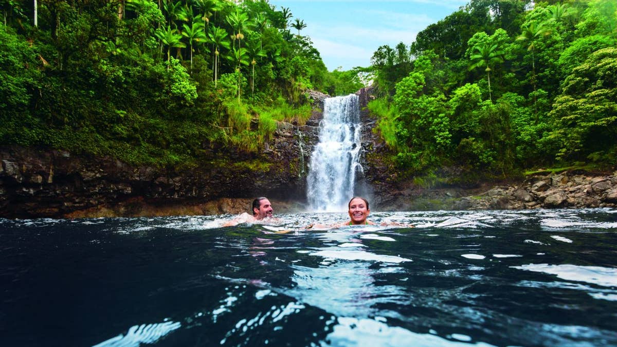 5---ncl-hawaii-couple-waterfall-swim-fun