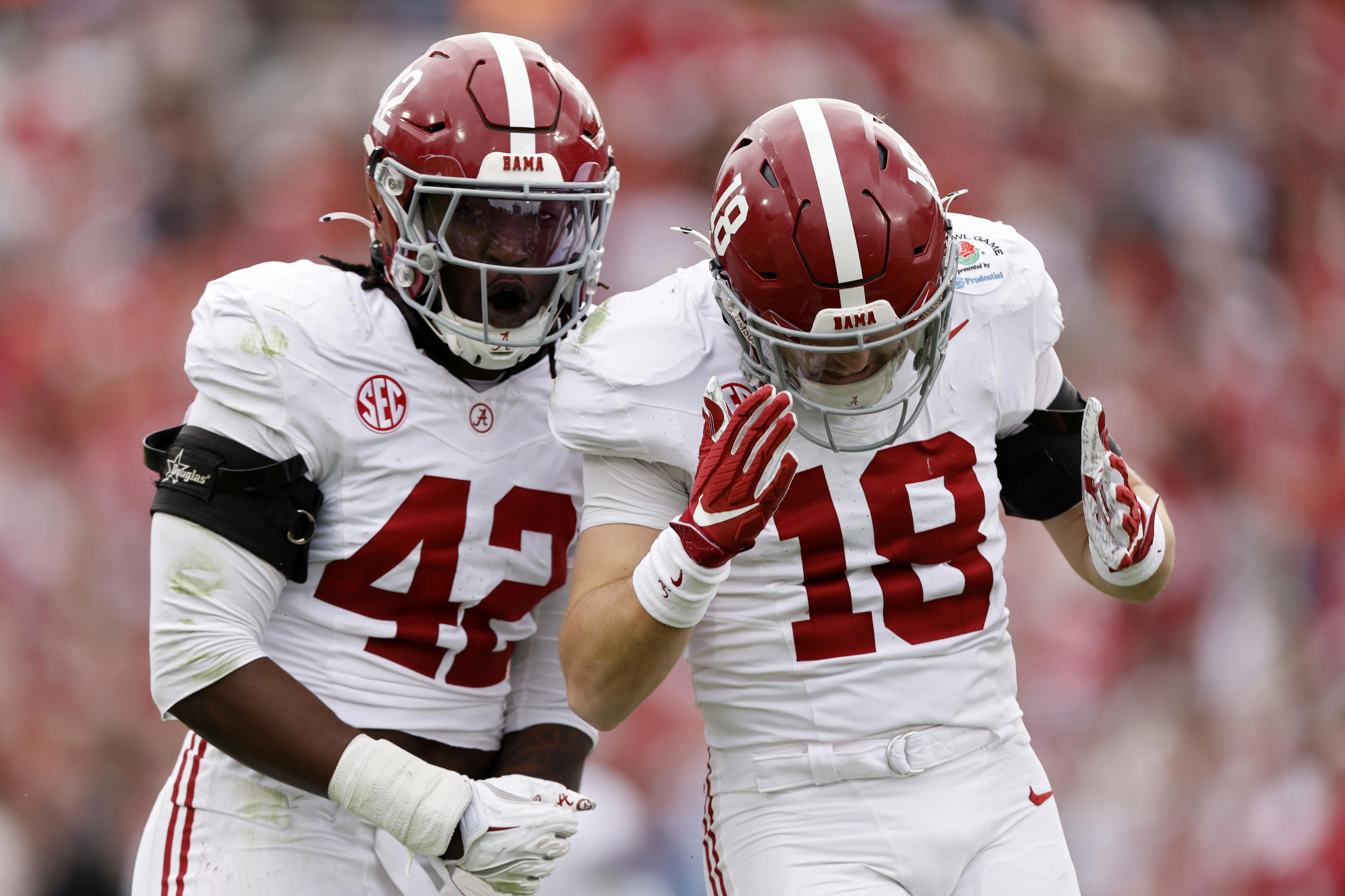 PASADENA, CALIFORNIA - JANUARY 01: Yhonzae Pierre #42 and Bray Hubbard #18 of the Alabama Crimson Tide celebrate after Hubbard recorded a sack in the first quarter against the Indiana Hoosiers in the College Football Playoff Quarterfinal at Rose Bowl Stadium on January 01, 2026 in Pasadena, California. (Photo by Harry How/Getty Images)