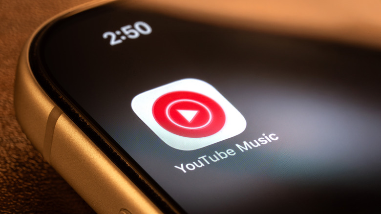 The YouTube Music app icon on a smartphone