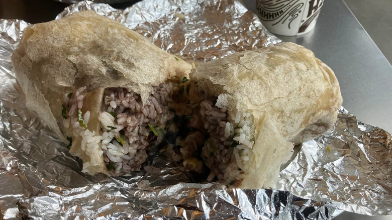 Open rice burrito on foil
