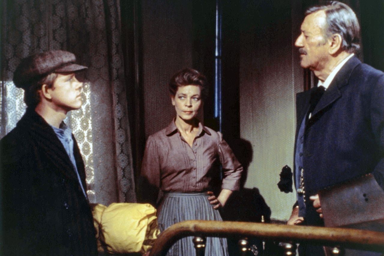 American actors Ron Howard, Lauren Bacall and John Wayne on the set of The Shootist, based on the novel by Glendon Swarthout and directed by Don Siegel