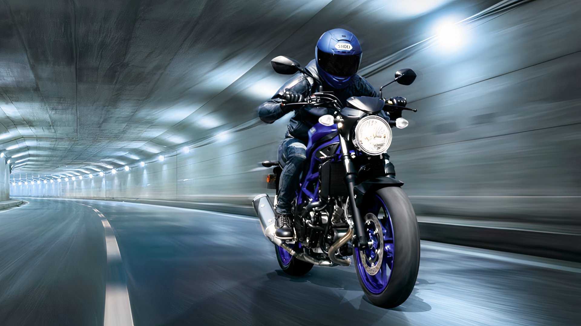 A rider riding aboard the Suzuki SV650 in a tunnel