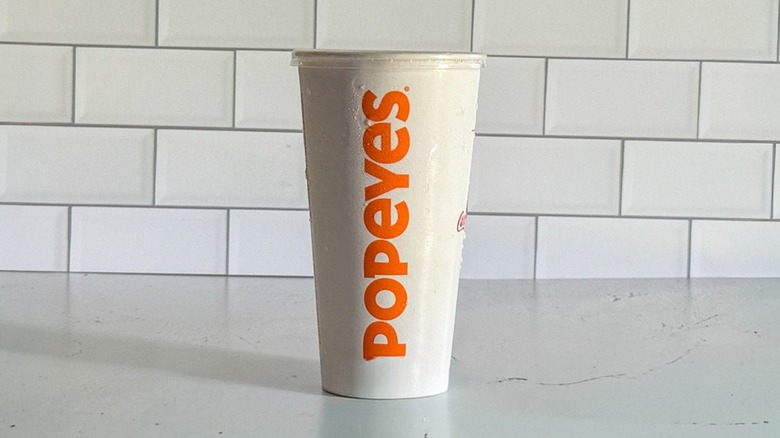 A regular Popeye's cup containing sweet tea