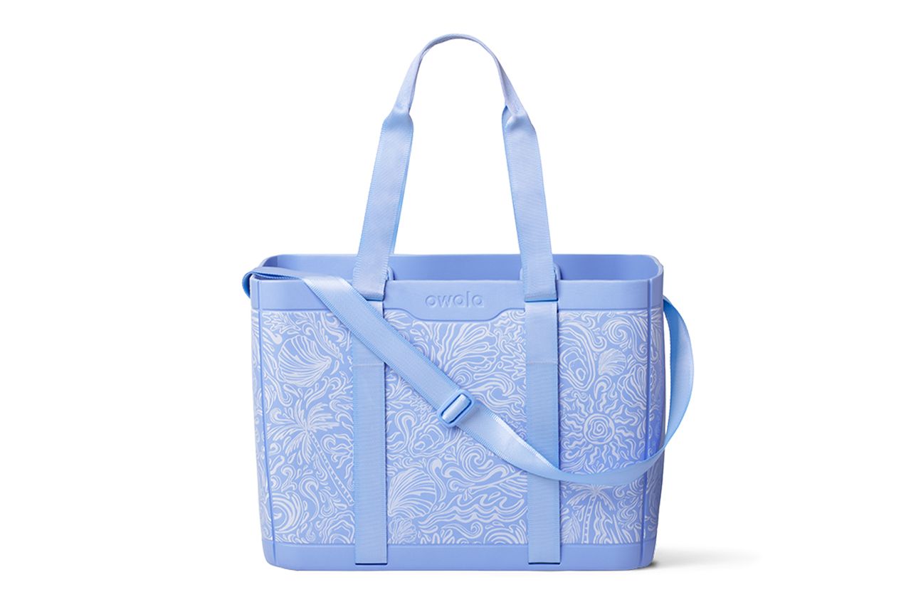 A tote bag with a patterned design featuring two handles and an adjustable shoulder strap