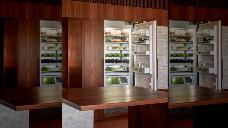 A Fisher & Paykel﻿ refrigerator with wood paneled finish that perfectly blends into kitchen cabinetry