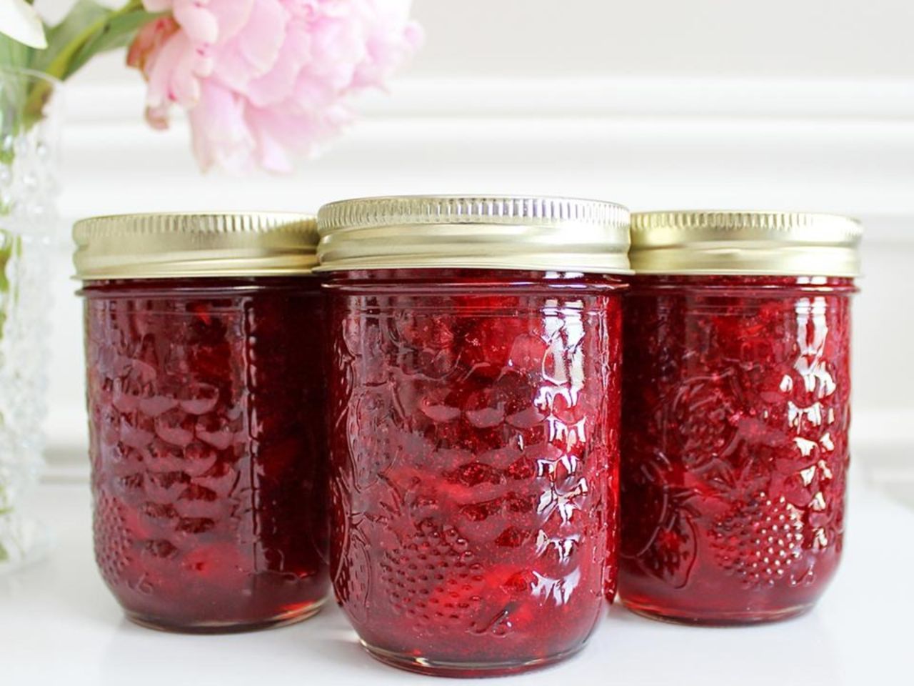 Homemade cherry jam in decorative jars