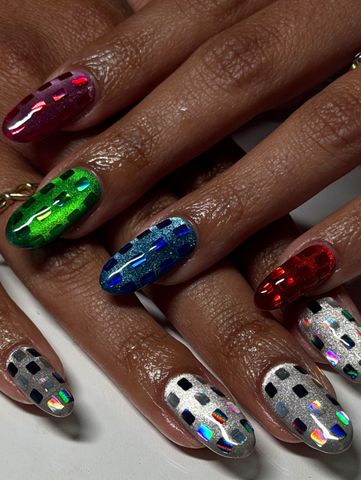 Closeup of hands showing nails with colorful and metallic designs