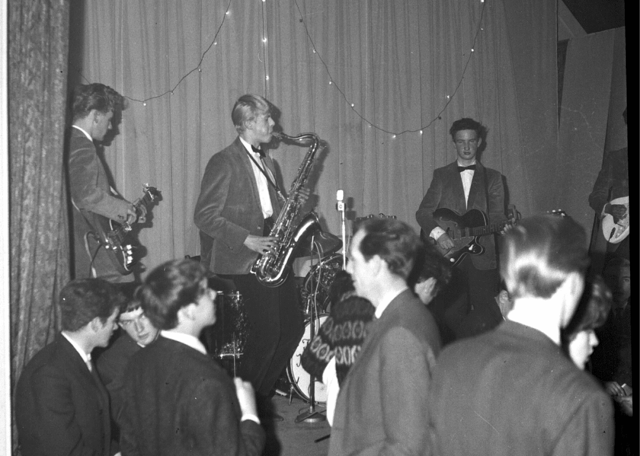 The Kon-Rads performing on stage with Bowie playing the sax.