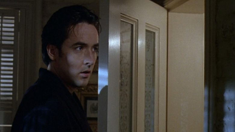 John Cusack's John Kelso looks out of his front door in Midnight in the Garden of Good and Evil