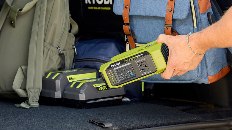 Ryobi portable power source packed into a car's trunk.