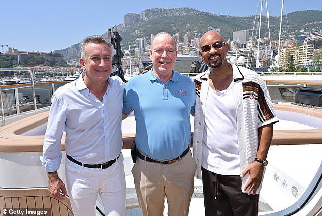 He posed for pictures with such high-flyers as Monaco's reigning Prince Albert and Spanish businessman Alejandro Agag, the founder and chairman of E1