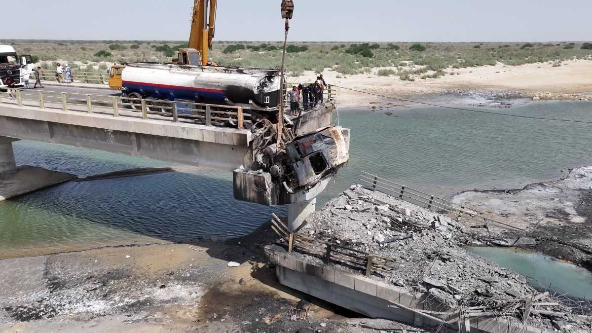 In this handout photo by Morteza Akhoundi via Getty Images, workers clean up wreckage around a damaged bridge, following U.S. airstrikes carried out a day earlier, on July 17, 2026 in the southern Hormozgan Province, Iran. The strikes targeted bridges linking Hormozgan province with neighboring cities, disrupting key transportation routes, according to Iranian authorities. US Central Command did not confirm a list of its targets but said the recent attacks were intended to