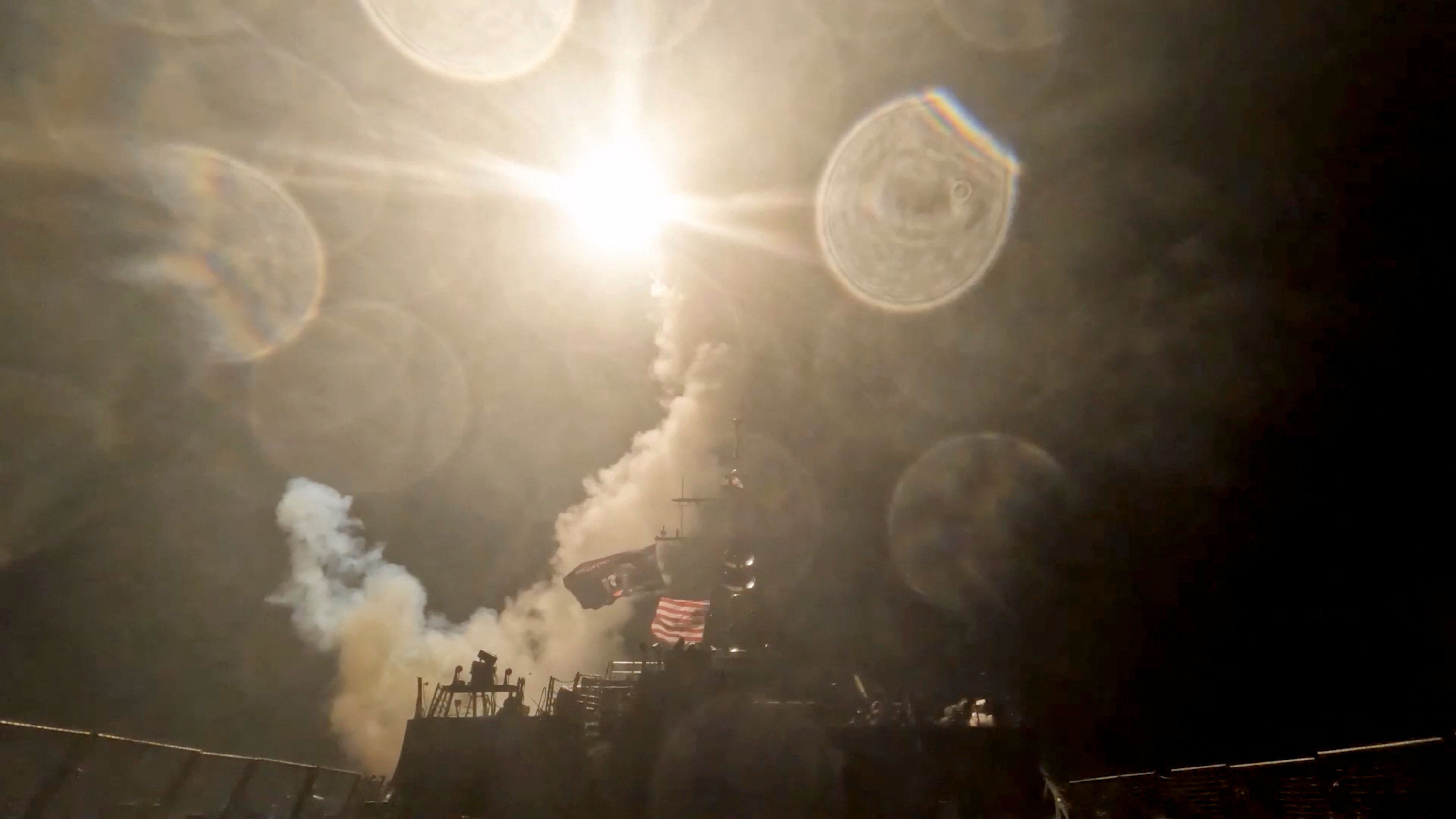 A US warship launches a munition at an unknown location during what the US military says is its latest wave of strikes on Iran (Reuters)