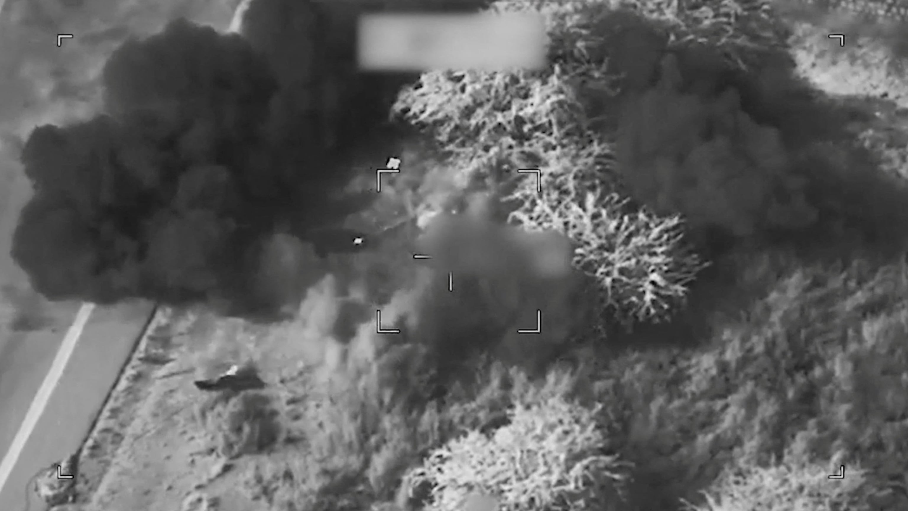 Smoke rises from a blast at an unknown location, during what the U.S. says are strikes on Iran. / U.S. Central Command / via REUTERS