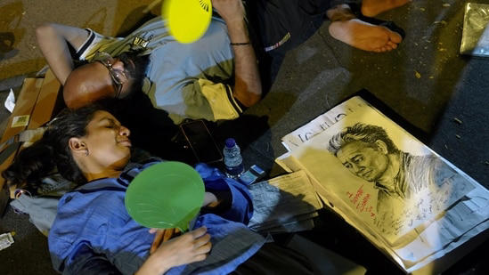 CJP supporters rest during a protest demanding Union Education Minister Dharmendra Pradhan's resignation over alleged irregularities in the NEET examination, at the Jantar Mantar.