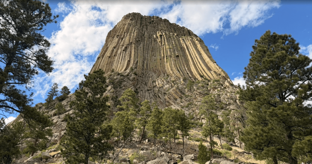 Looking up at Devils Tower in Wyoming on a summer day.