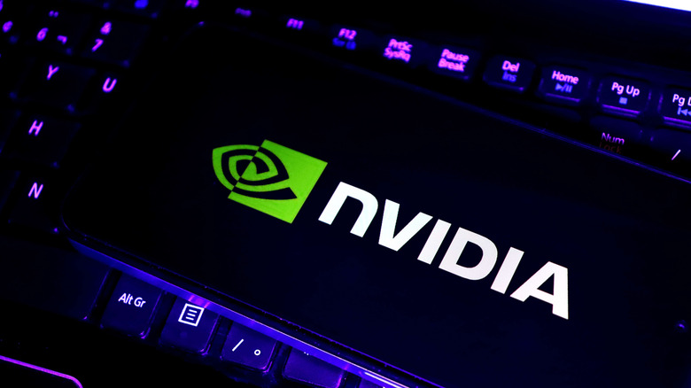 The Nvidia logo on a smartphone screen kept on top of a keyboard