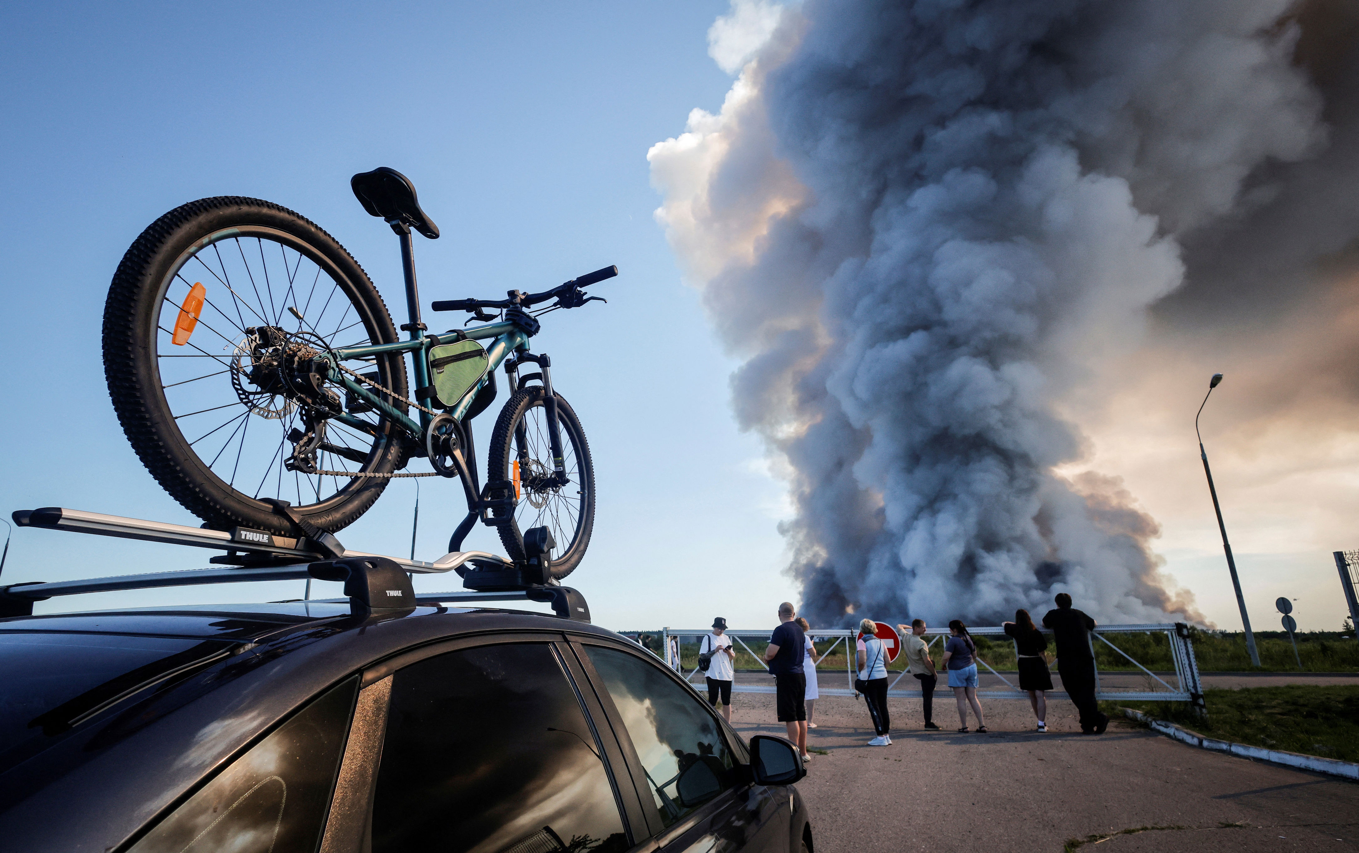 Bystanders watch the fire at the Wildberries complex (AFP/Getty)