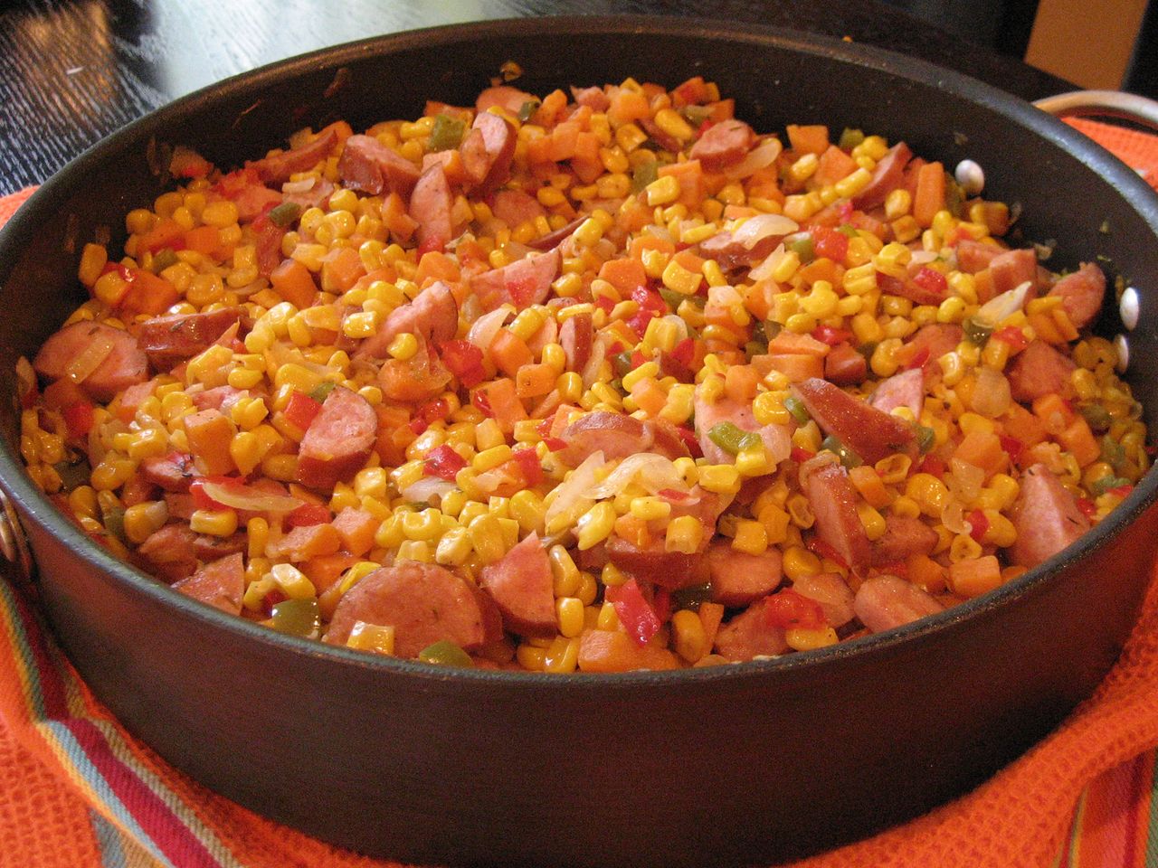 close up view of Fried Corn with Smoked Sausage in a pan