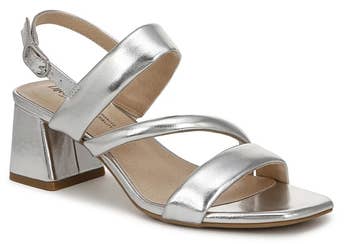 Silver strappy block-heeled sandal with ankle strap, displayed for a shopping article