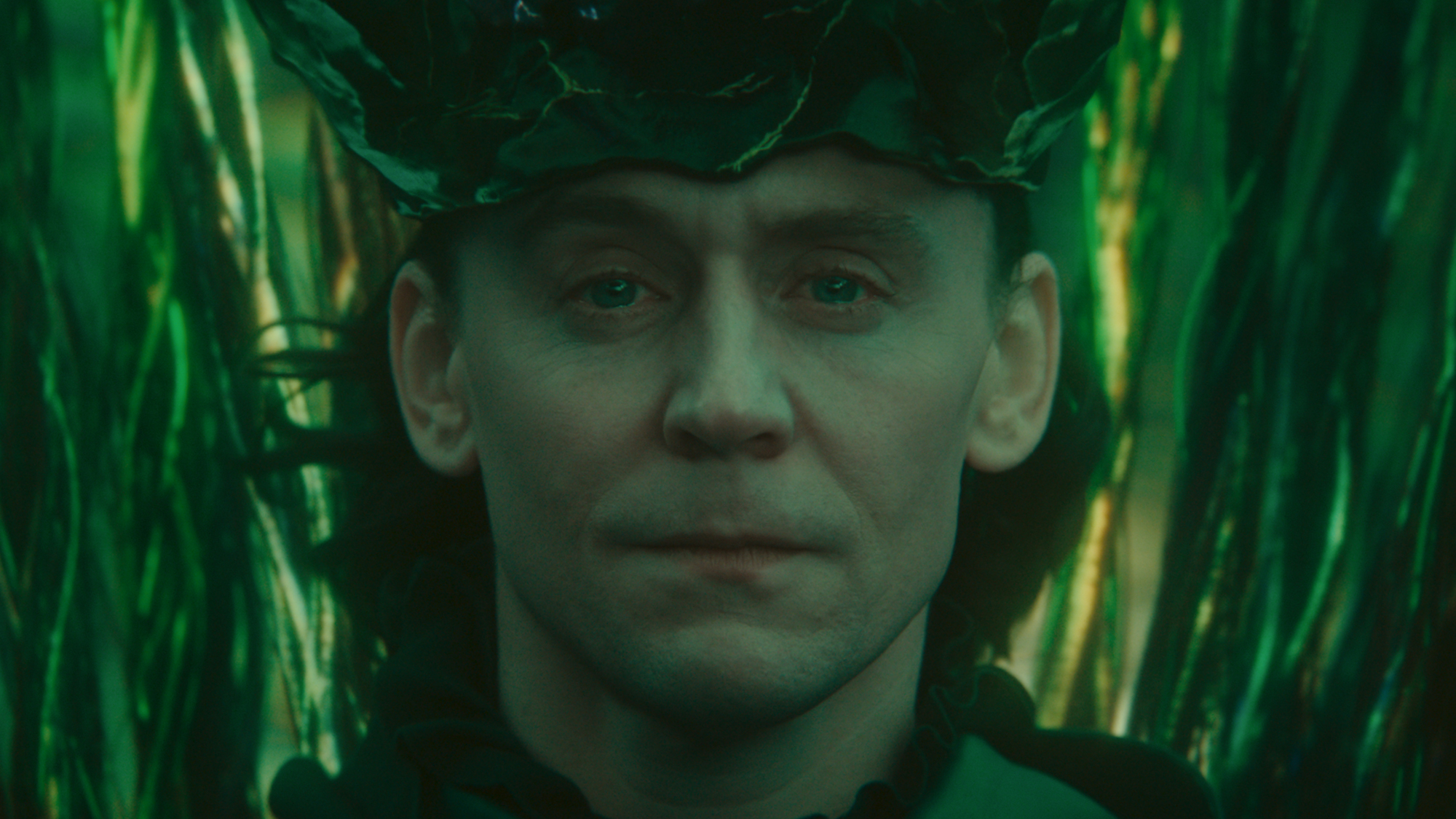 Loki (Tom Hiddleston) watches his friends in Loki.