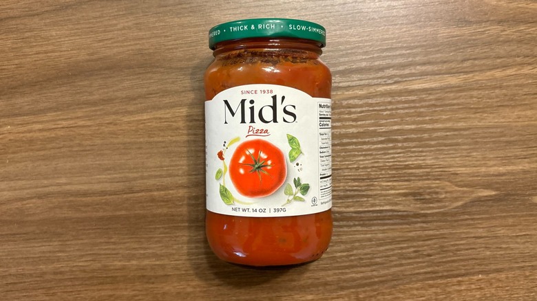 Mid's Pizza Sauce jar on wooden table