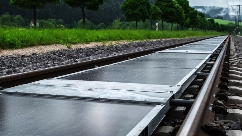 A close-up of the Sun-Ways solar panel system for train tracks.