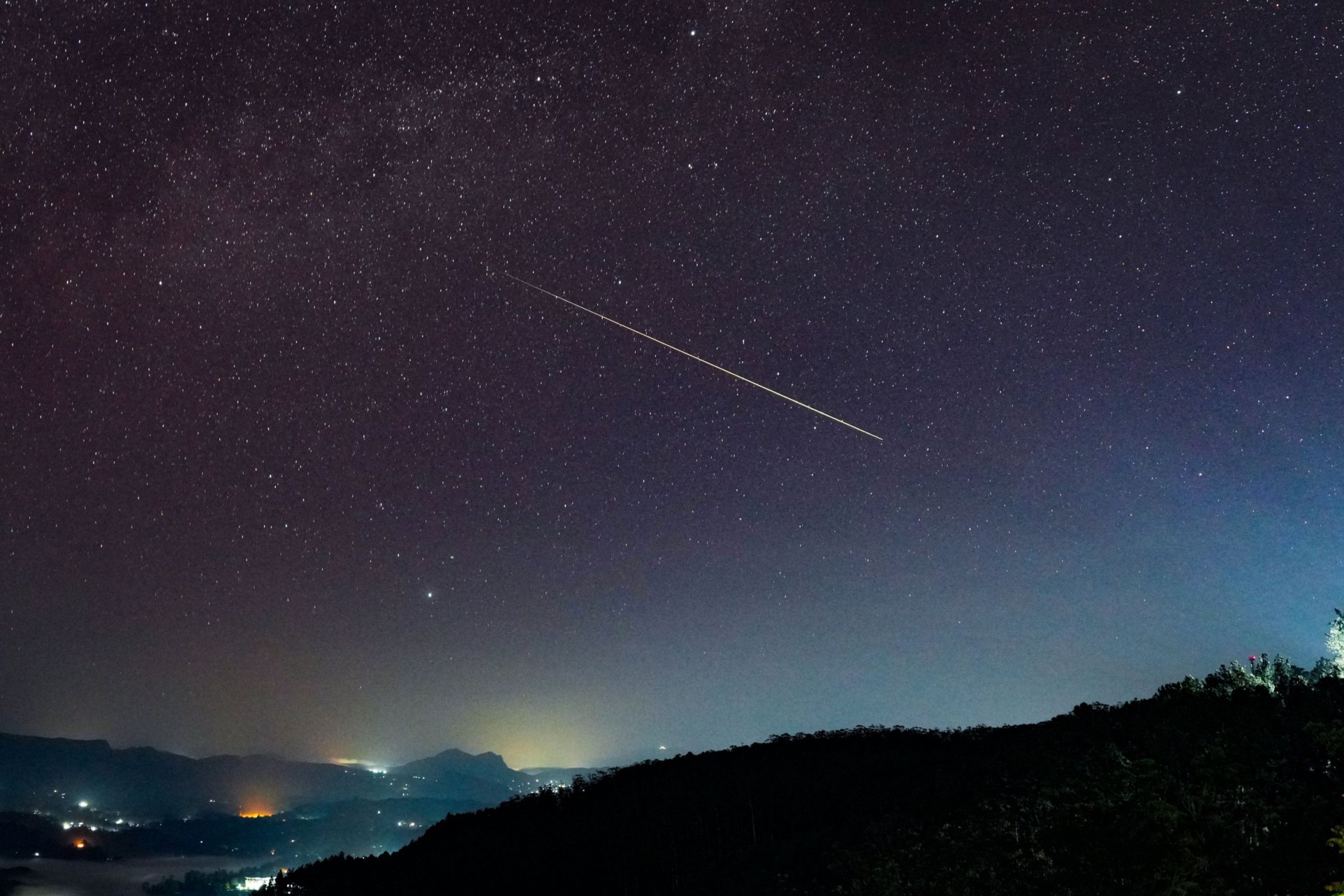 A huge Perseid meteor is being seen over the night sky in Haputale, Sri Lanka, on August 4, 2024.