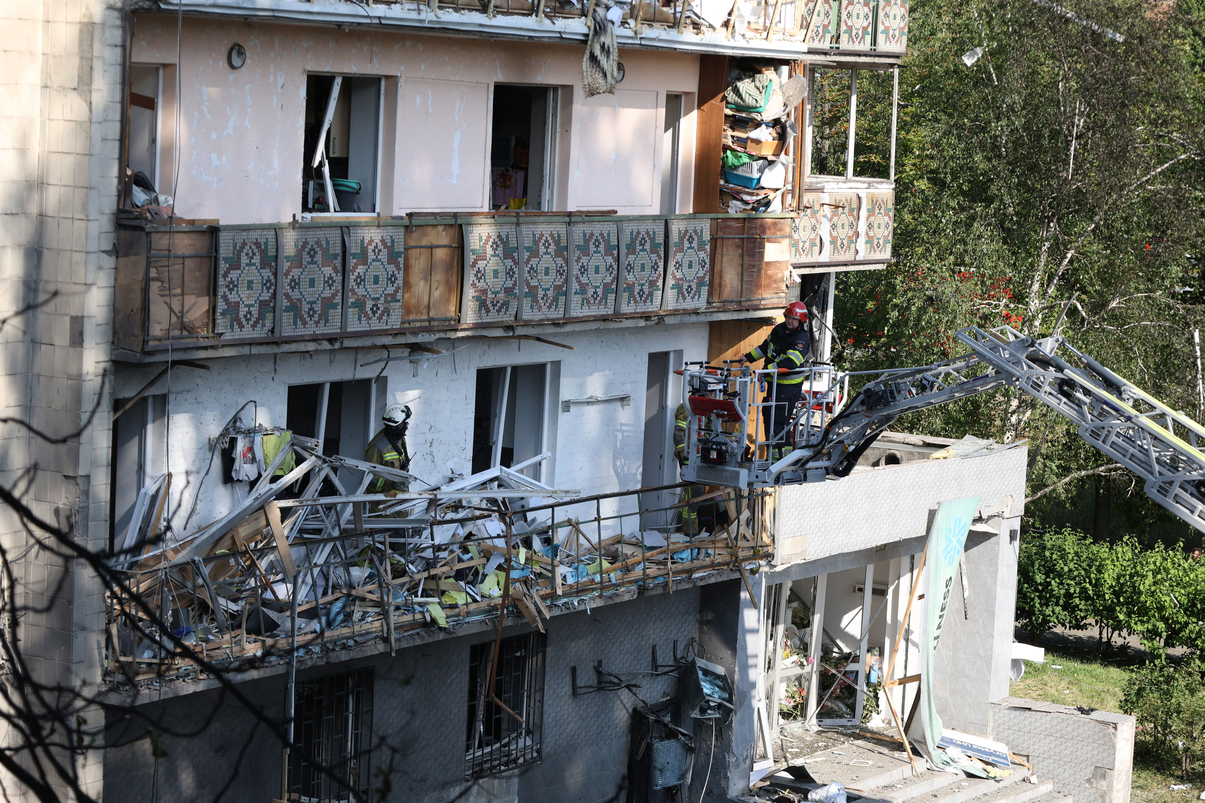 Rescuers work on a residential building following a Russian missile strikes in Kyiv (AFP/Getty)