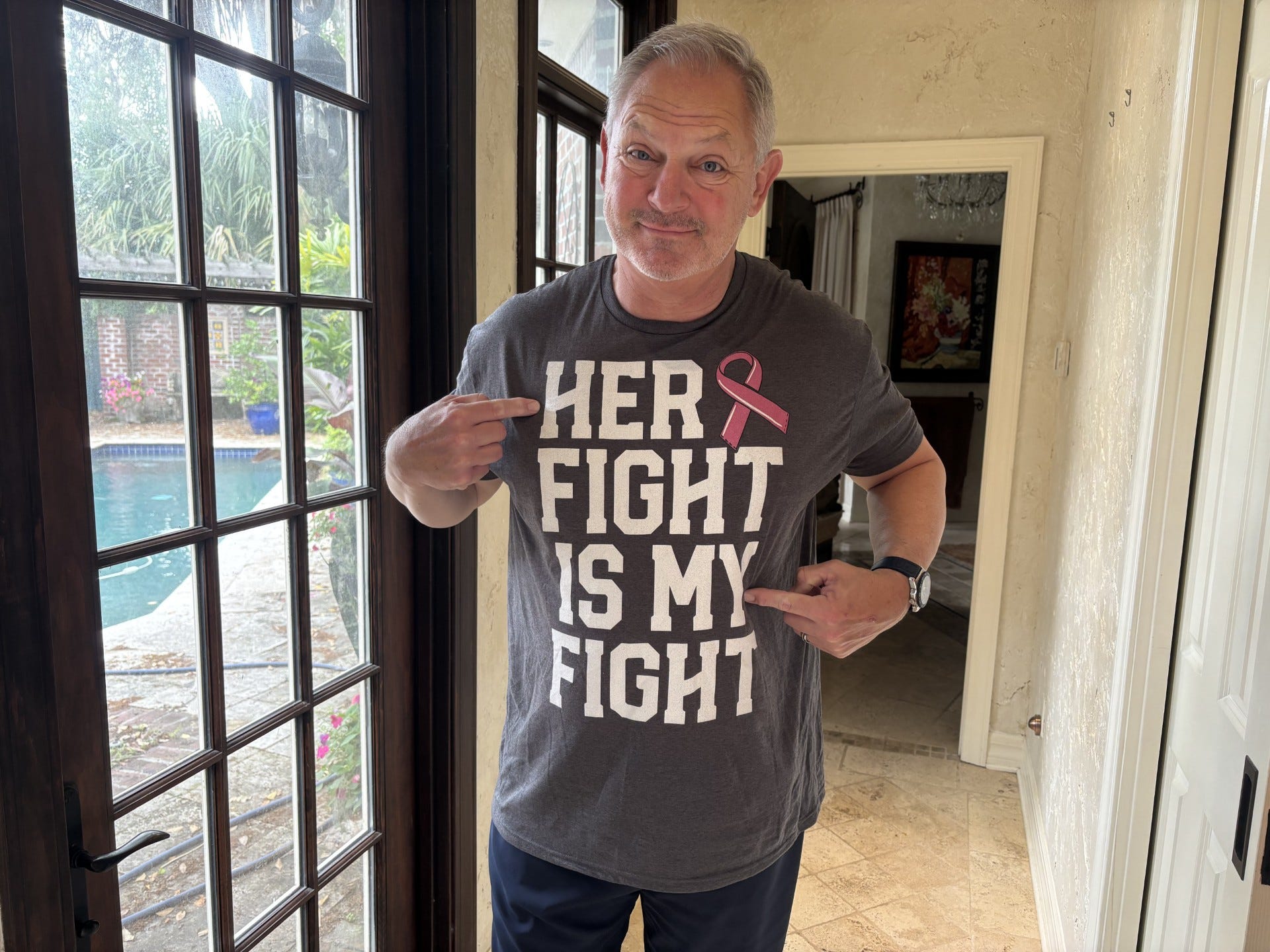 Bill Lyle, husband of First Coast News anchor Jeannie Blaylock, shows his support in her breast-cancer fight. Earlier this year she was diagnosed with early-stage breast cancer, one of many lives saved by her longtime Buddy Check 12 breast cancer awareness initiative.