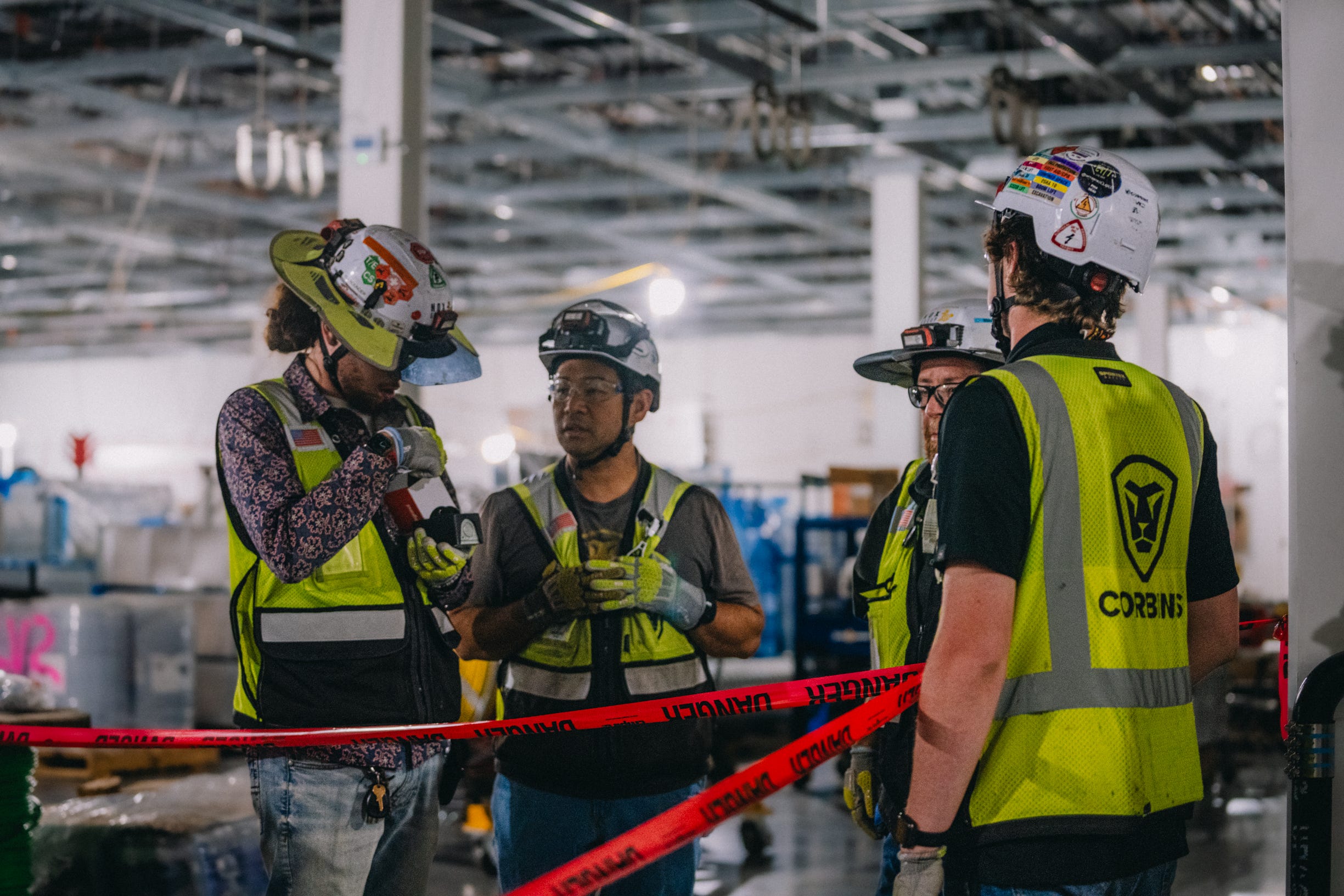 Four Corbins employees gather in a group