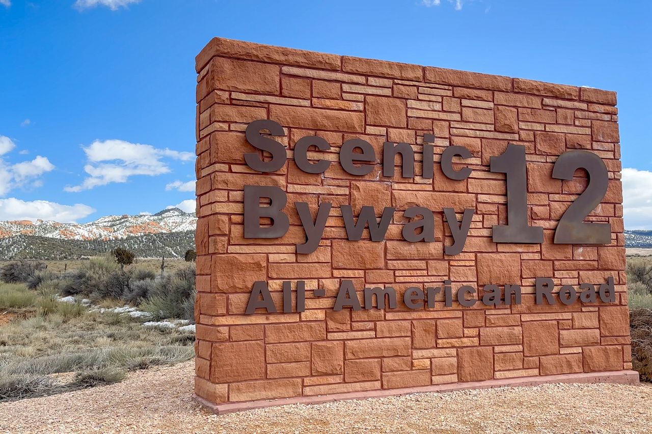 Sign for Scenic Byway 12 AllAmerican Road with mountainous landscape in background