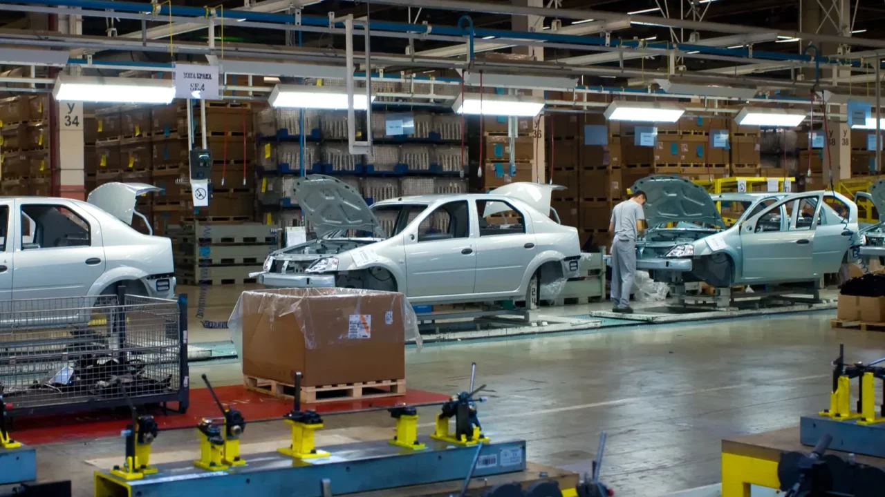 Shot of assembly line of cars in an automobile factory.