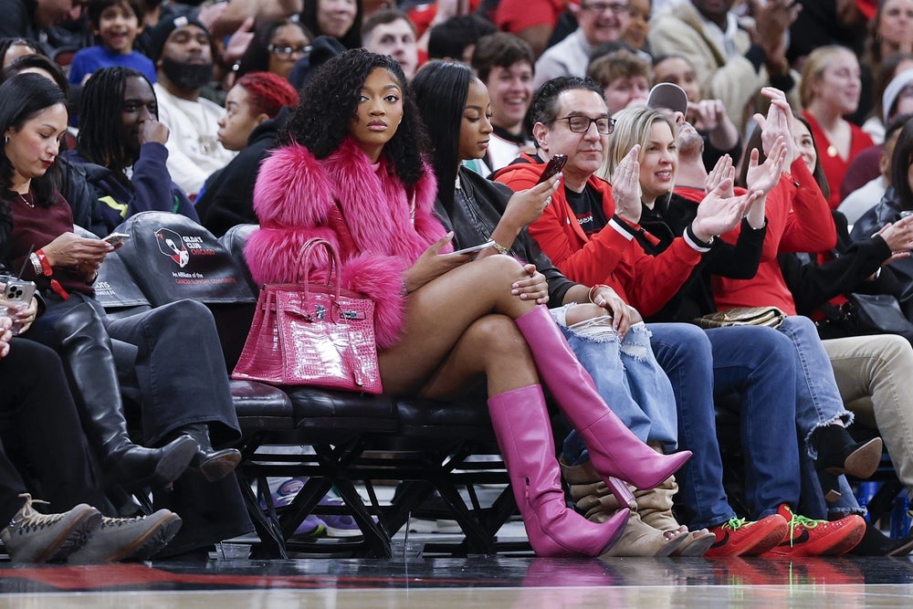 Jan 2, 2026; Chicago, Illinois, USA; Chicago Sky forward Angel Reese watches a NBA game between the Chicago Bulls and Orlando Magic during the first half at United Center. Mandatory Credit: Kamil Krzaczynski-Imagn Images