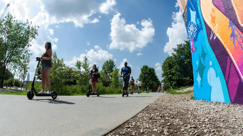 People riding scooters on Atlanta BeltLine with a view of the sky
