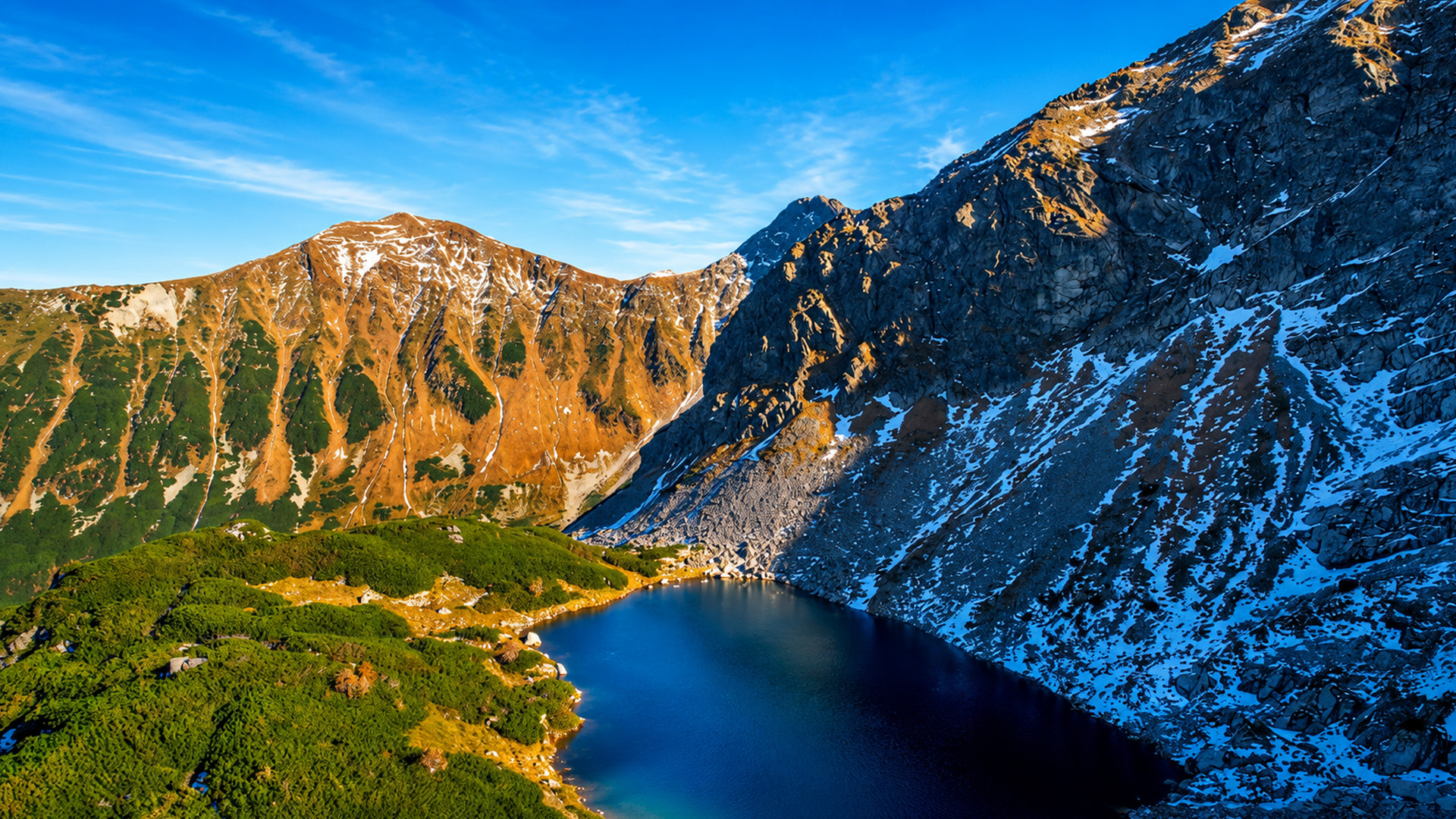 Why is Roháčske Pleso hidden beneath these snowy peaks?