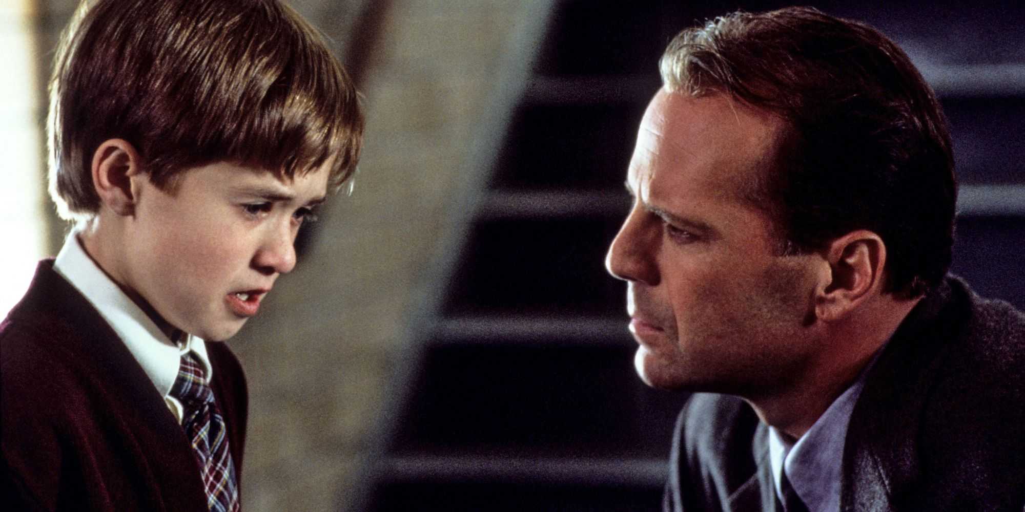 Malcolm and Cole speaking in front of stairs in The Sixth Sense.