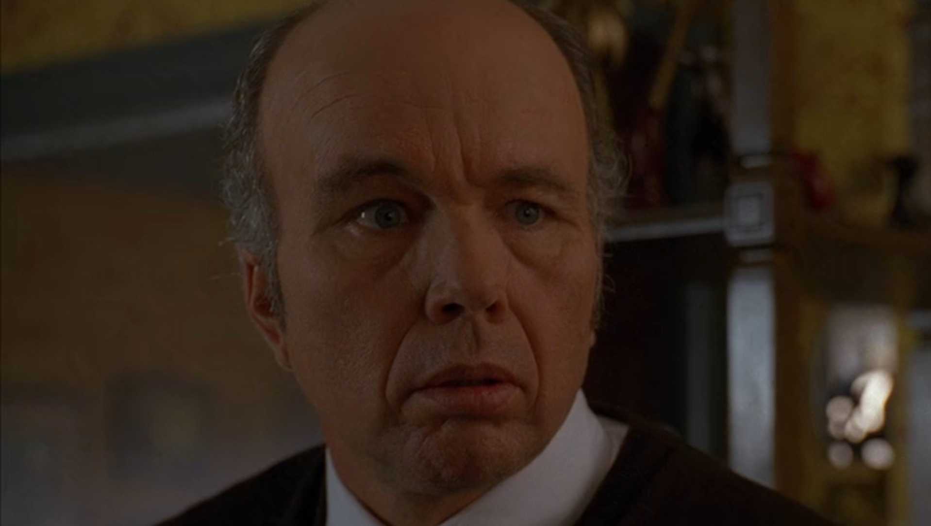 Tom Miller looking at Sylar with a confused expression