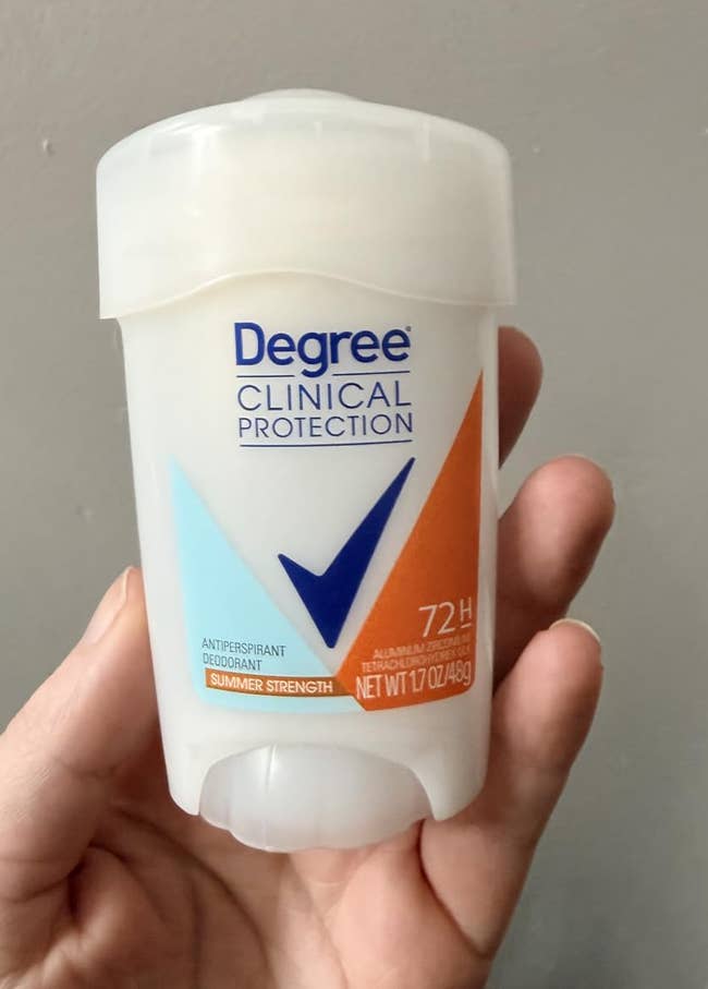 A hand holds Degree Clinical Protection deodorant, offering 72-hour antiperspirant protection