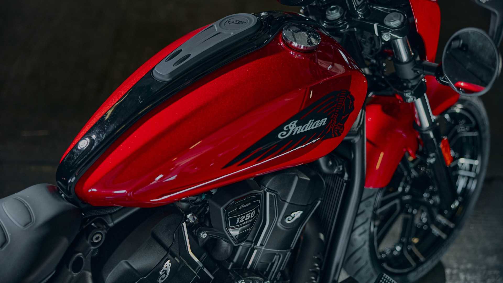 2026 Indian Sport Scout RT in red flaunting its cool fuel tank stickers rear third quarter ariel view