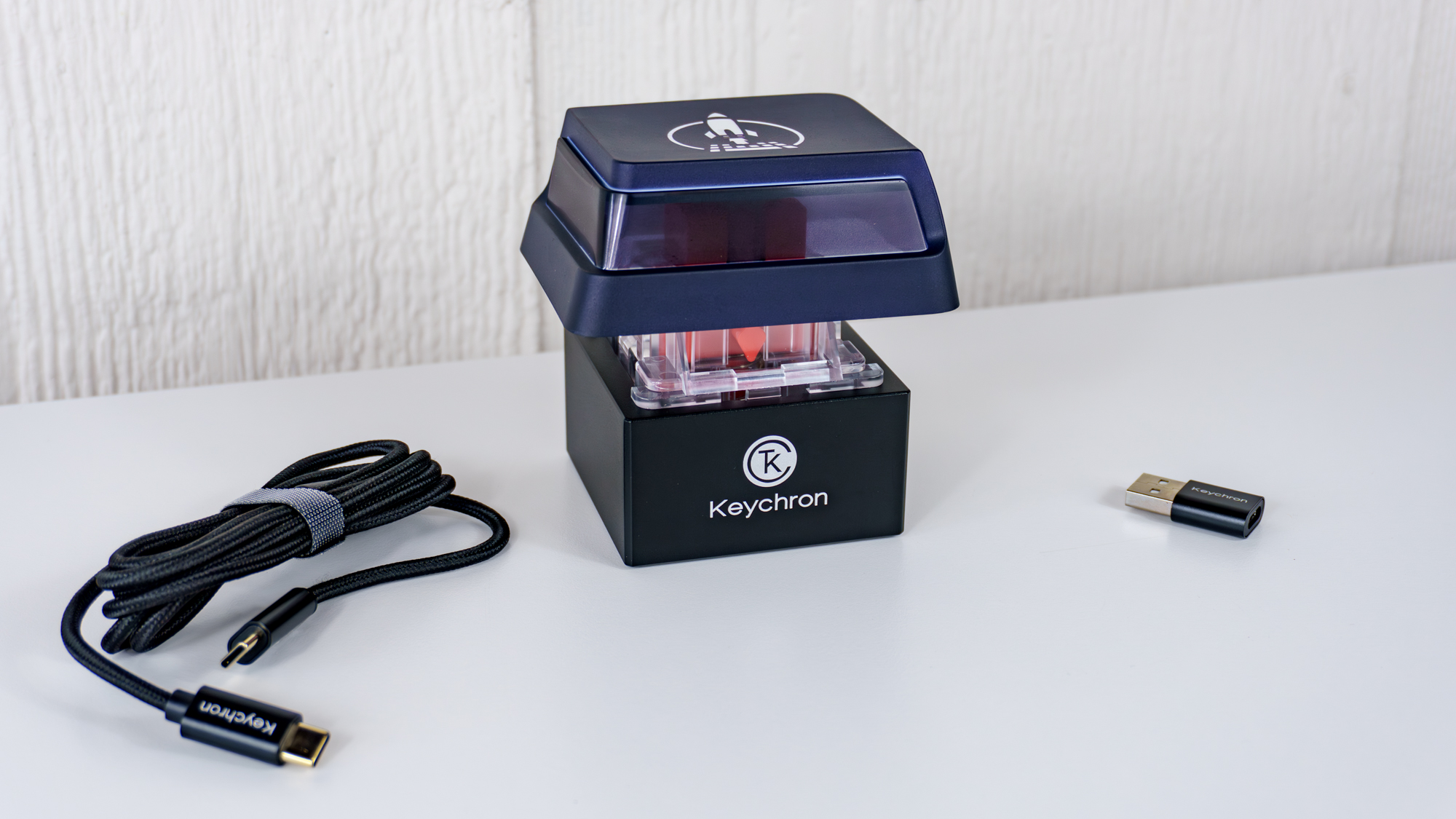 The Keychron Q0 Mini 8K Action Key unboxed on a table