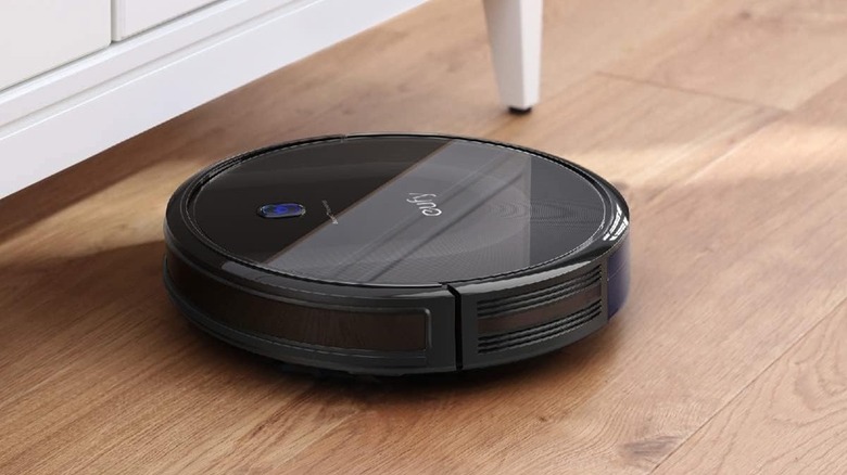 Eufy 11S Max robot vacuum cleaning a wooden floor
