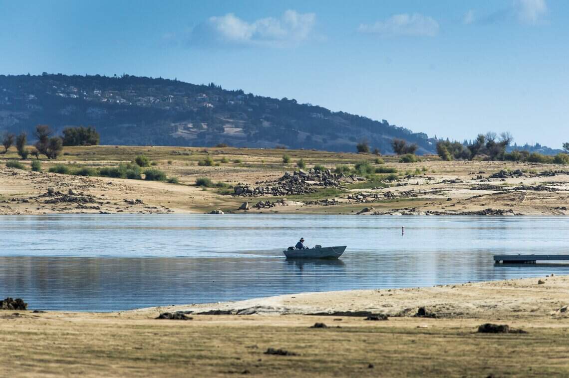 A boater navigates Folsom Lake in 2016, after the year’s so-called “Godzilla” El Niño didn’t produce enough rainfall to end a drought.