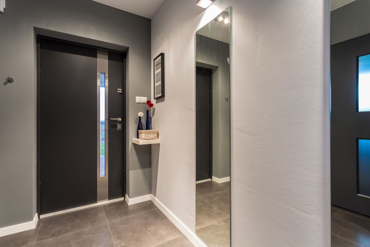 Modern apartment entryway with gray walls