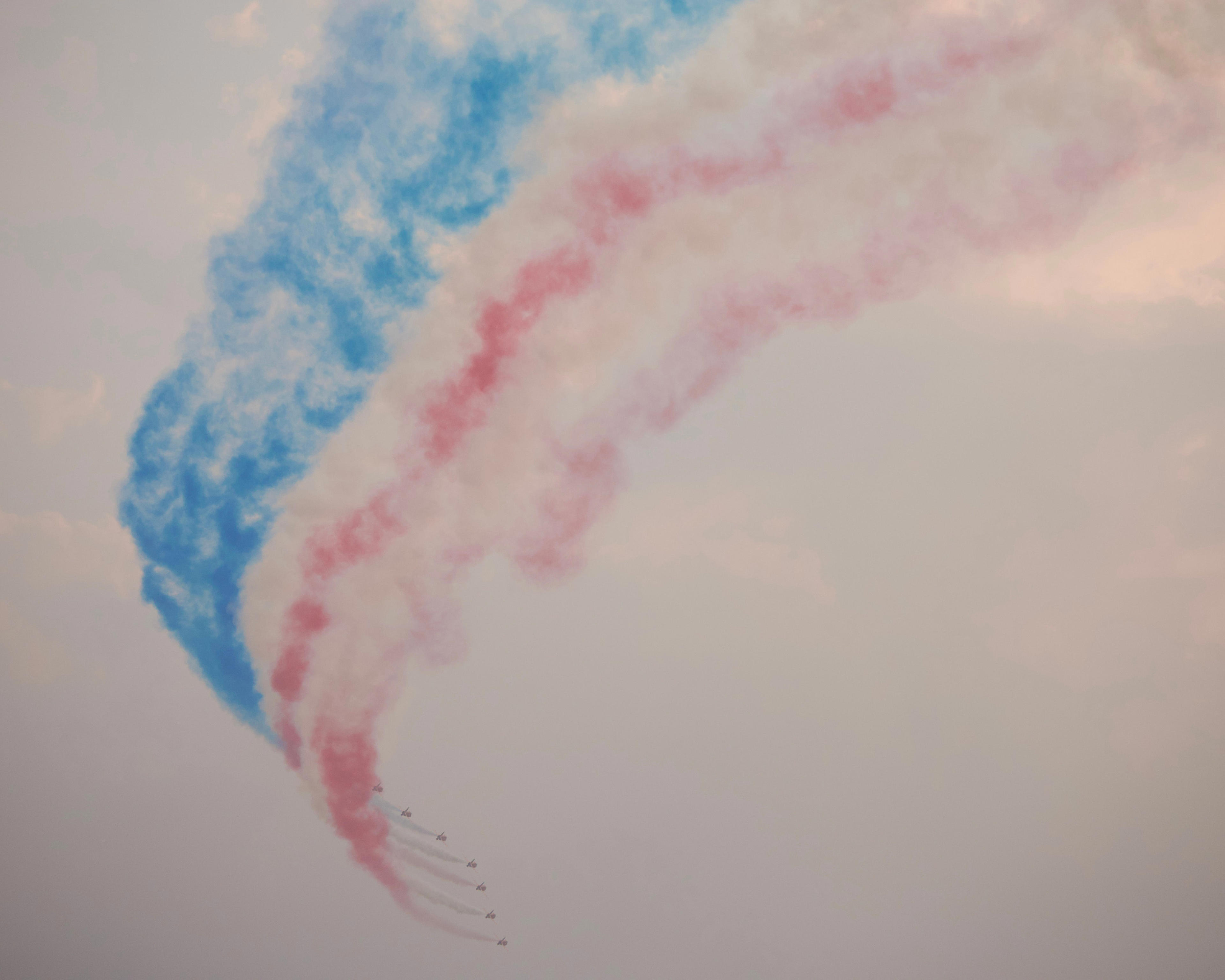 The Royal Air Force Red Arrows create an American flag using smoke during Thunder Over Michigan at Detroit Willow Run Airport on Saturday, July 18, 2026.