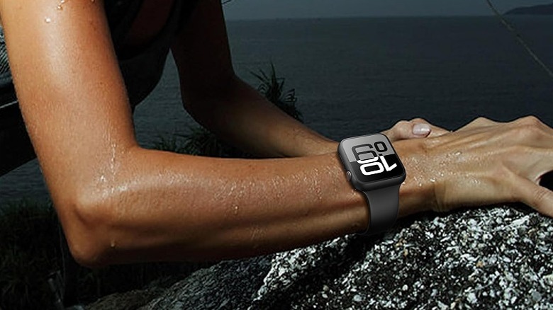 Woman wearing an Apple Watch in wet conditions.