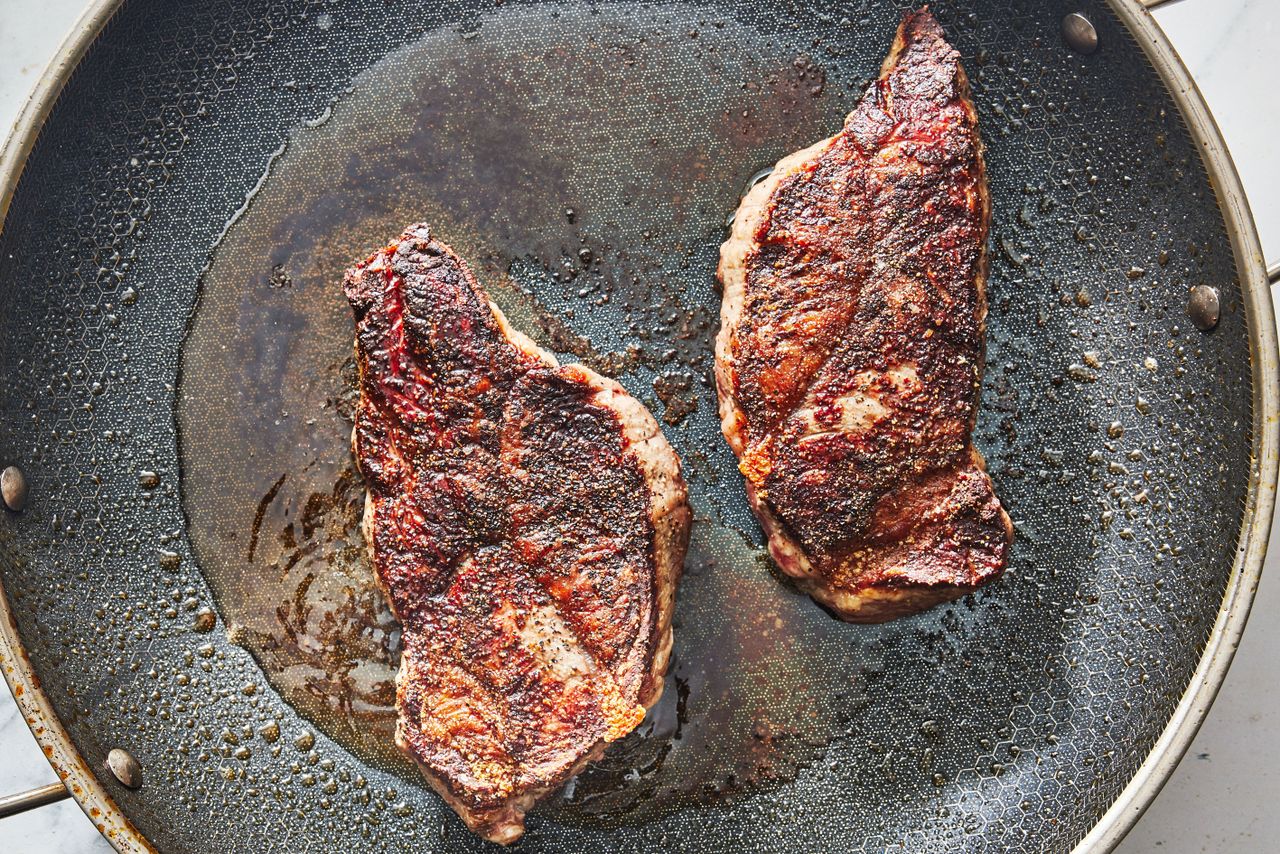 One Skillet Parmesan Butter Steak Pasta browning the steak in a large skillet