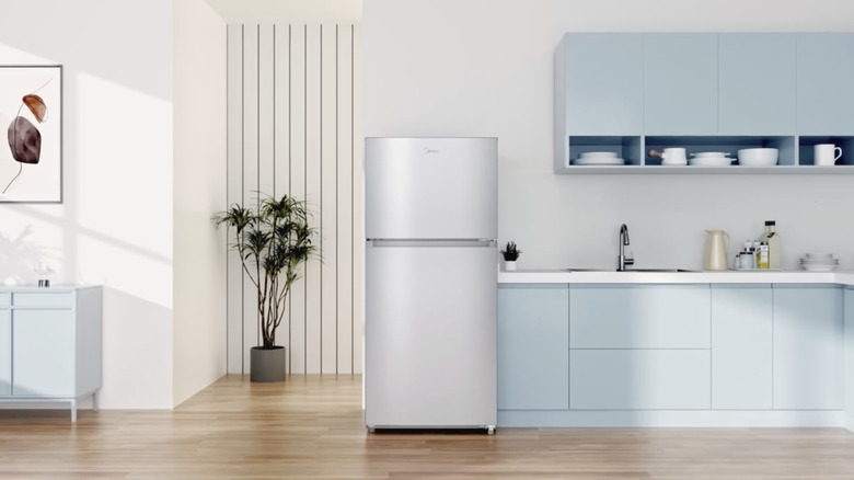 A stainless steel fridge with two compartments
